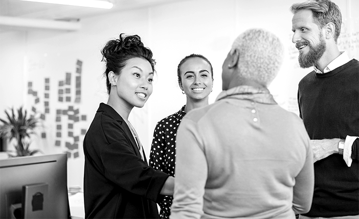 A group of people talking to each other in an informal meeting
