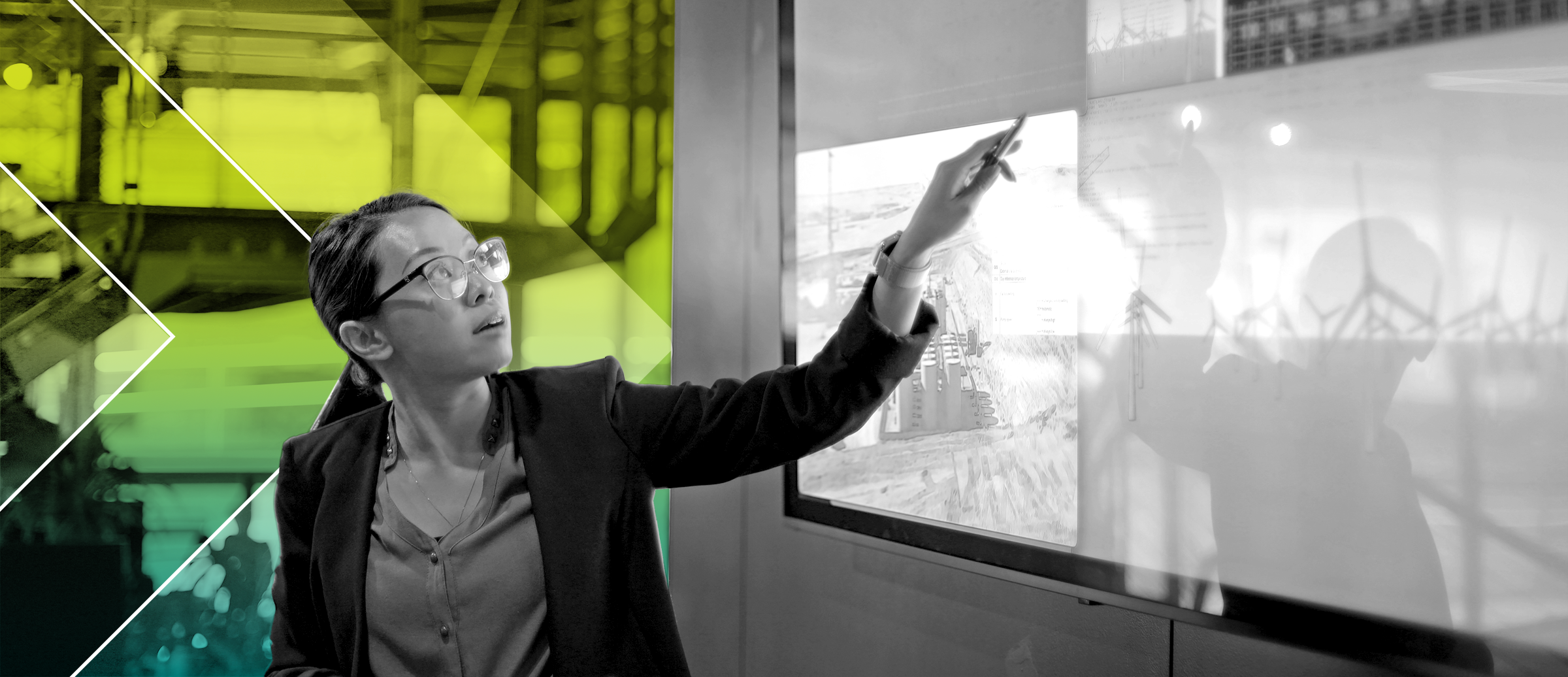 A person pointing at a screen