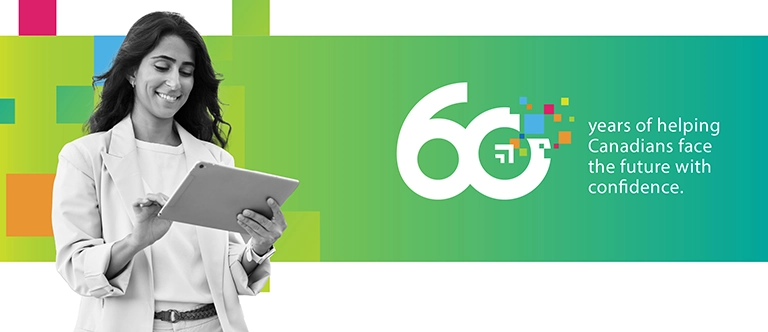 A woman smiling and looking at a tablet.