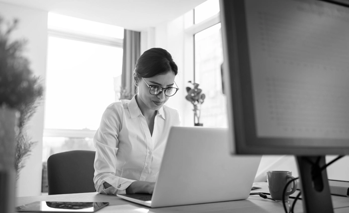 A woman working on a laptop