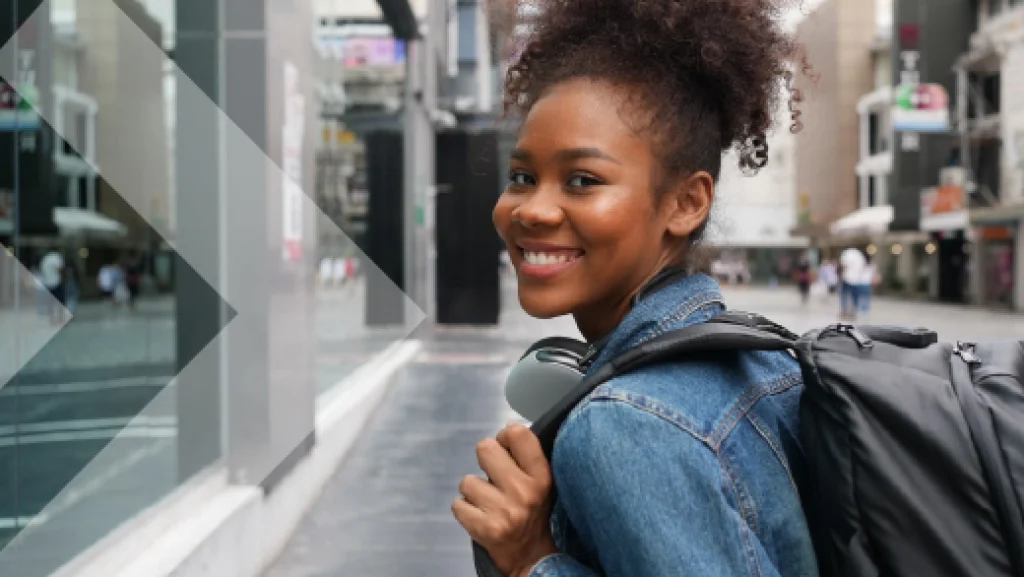 A young woman smiling and looking at the camera.