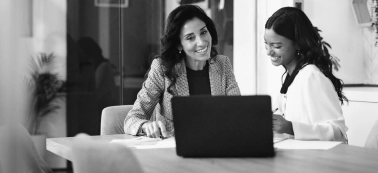 Two women in a work meeting.