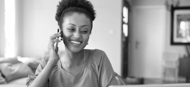 A woman speaking by phone.