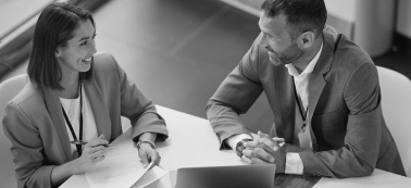 A man and a woman during a work meeting. 