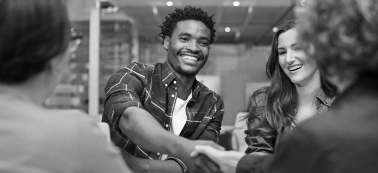 A man and a woman shaking hands.