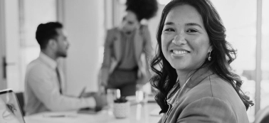 A woman smiling at camera.