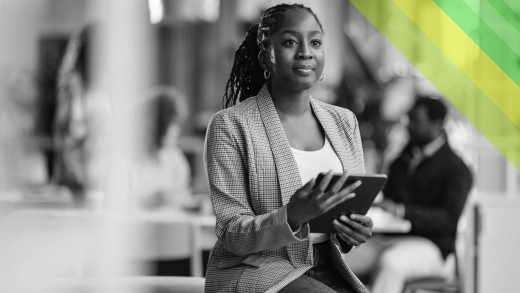 A woman with a tablet in an office.