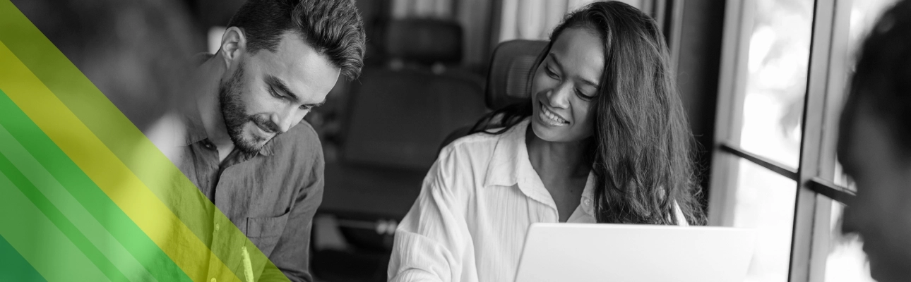 A man and a woman working in an office.