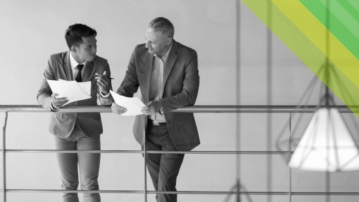 Two men reviewing some documents. 