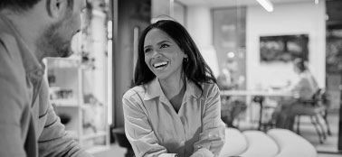 A woman smiling with a man.